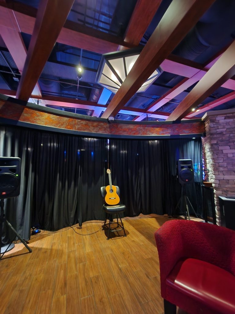 Acoustic guitar player for hire providing elegant background music for a Southern California wedding ceremony or upscale cocktail hour.